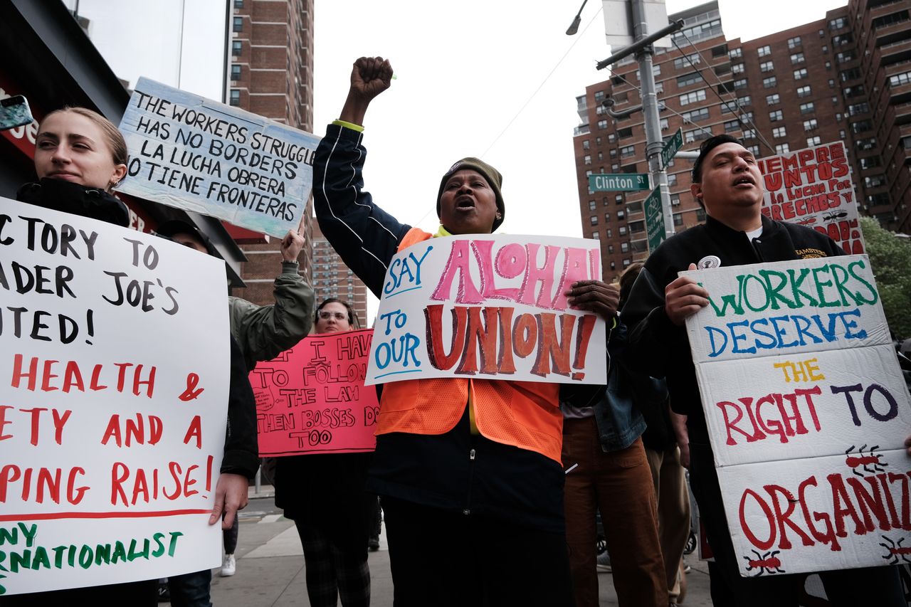 Trader Joe’s employees and union activists hold a rally April 18 at a Trader Joe’s in lower Manhattan in support of forming a union at the store.