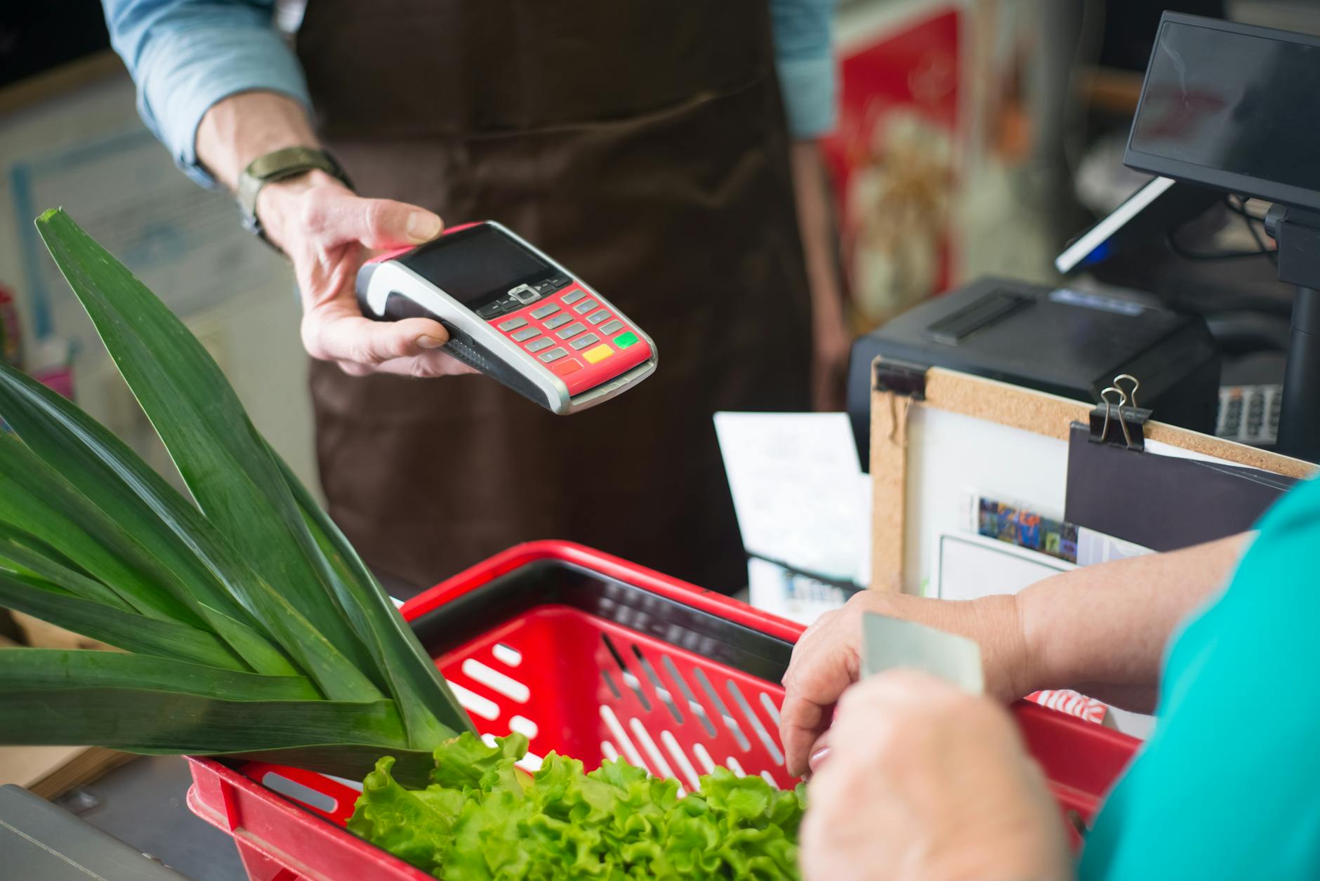 Modern grocery store checkout area with self-service kiosks and automated systems