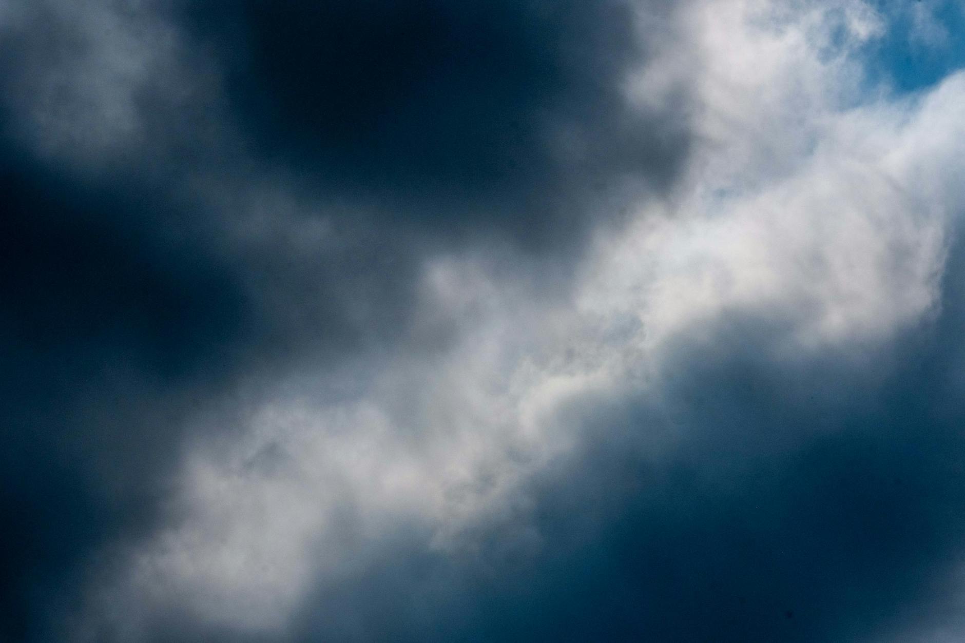 Dark storm clouds gathering over landscape showing changing weather patterns