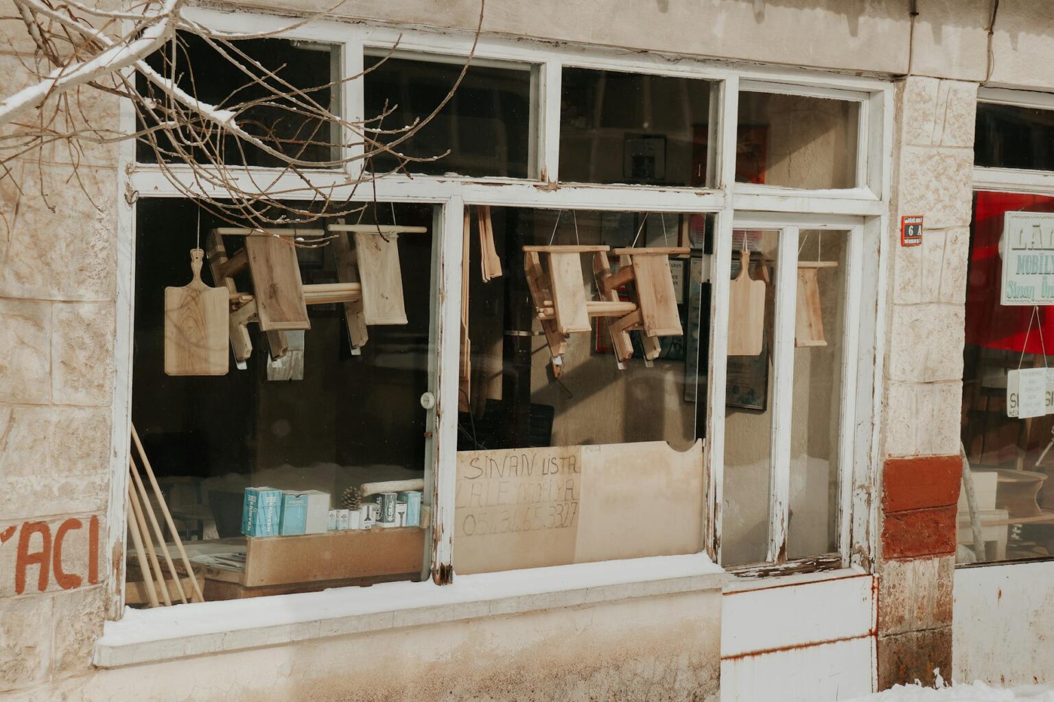 Empty retail storefront with "For Lease" signs in shopping center
