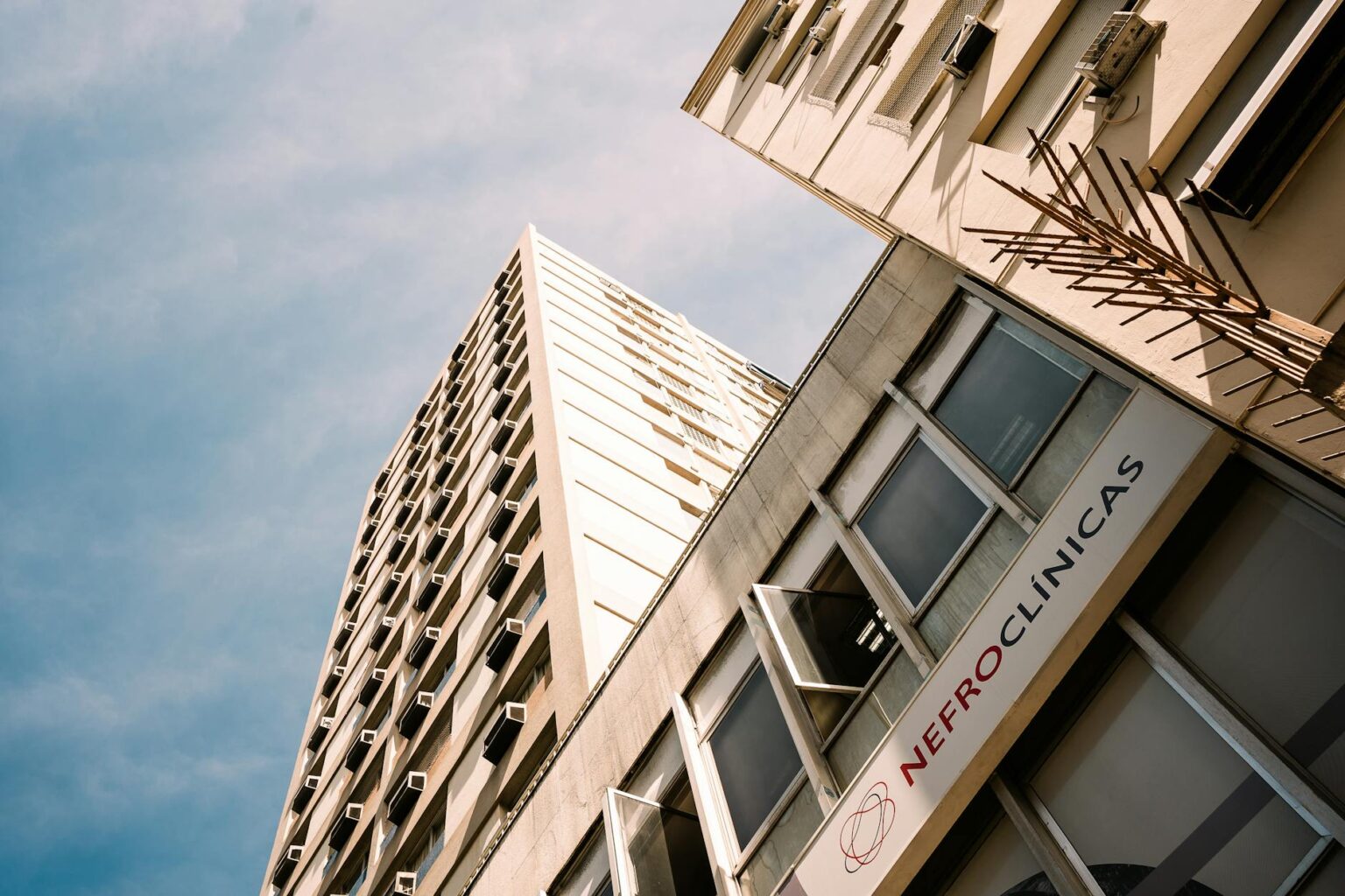 Modern medical office building exterior with glass facade and healthcare signage