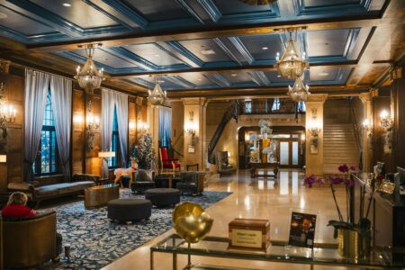 Major Hotel Chains Partner With Coworking Companies as Business Travel Shifts Modern hotel lobby with contemporary seating and workspace areas