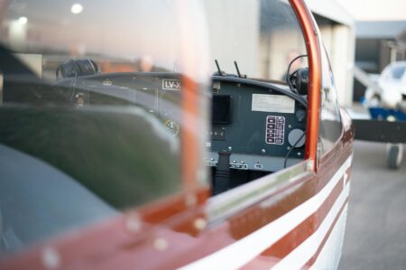 Commercial aircraft cockpit showing pilot controls and instruments