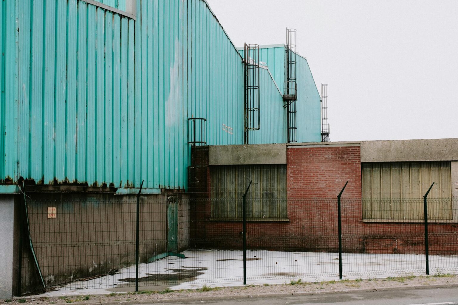 Modern industrial manufacturing facility with steel construction and large windows