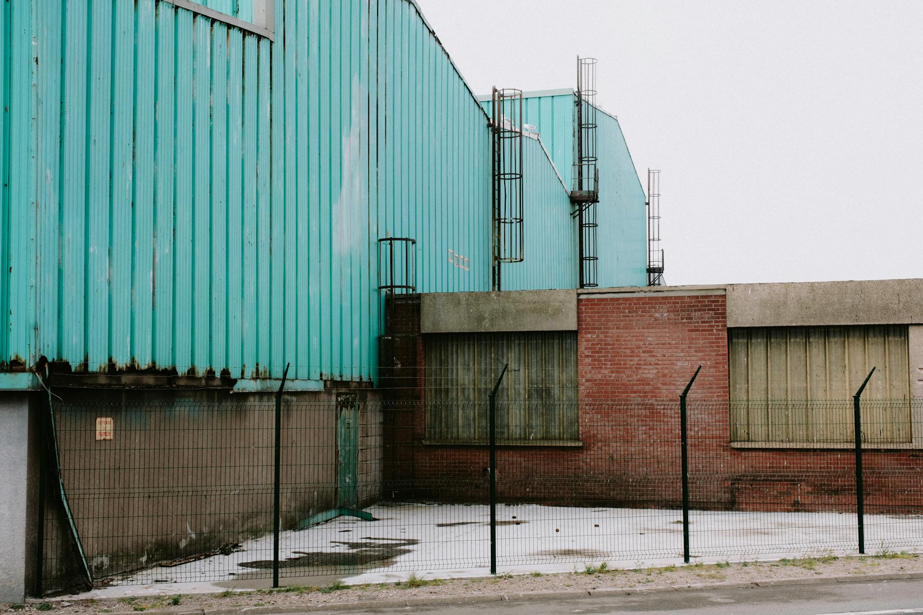 Modern industrial manufacturing facility with steel construction and large windows