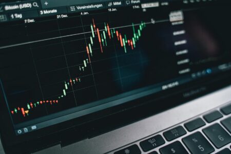 How AI Trading Algorithms Are Disrupting Traditional Wall Street Firms Modern trading floor with multiple computer screens displaying financial data and market charts