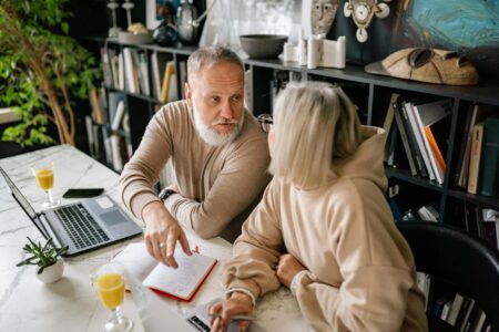 Senior man reviewing investment portfolio on laptop computer