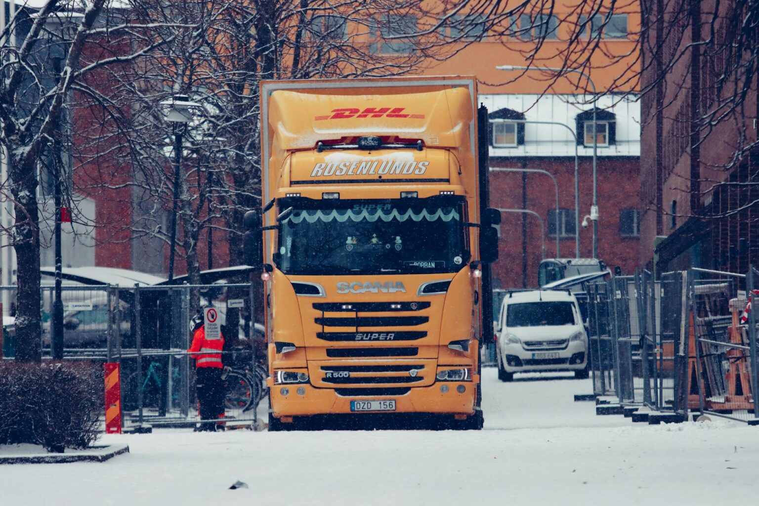 Moving truck on residential street representing tech worker relocation