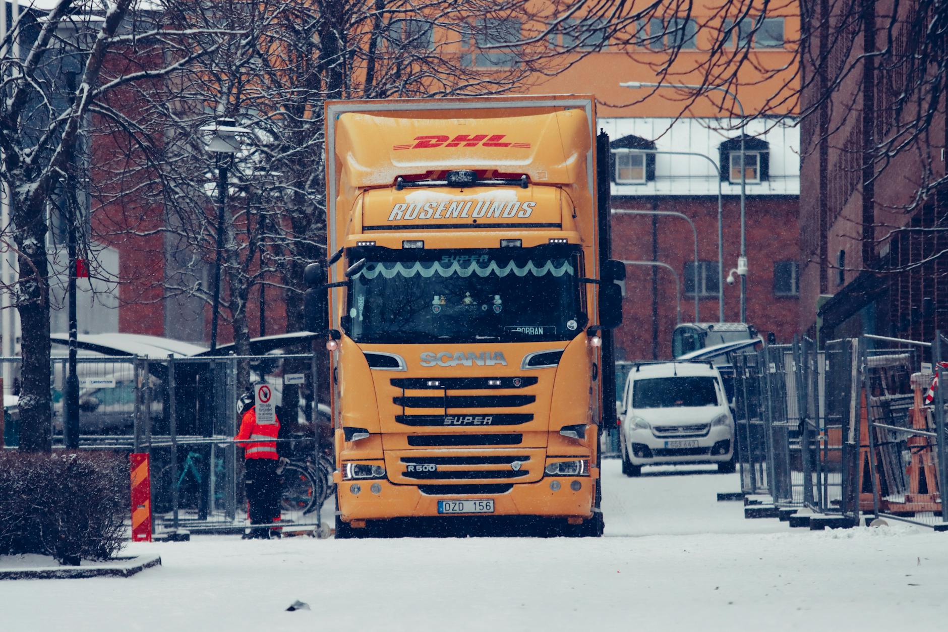 Moving truck on residential street representing tech worker relocation