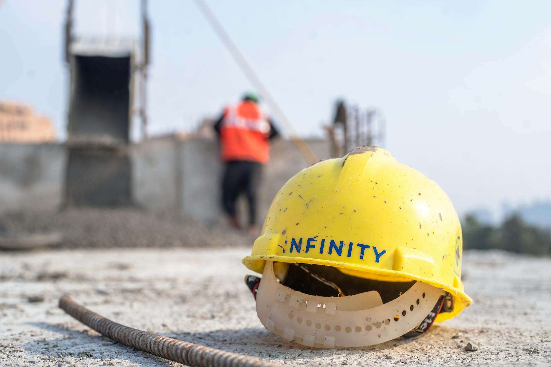 Workers in hard hats and safety gear at an industrial construction site