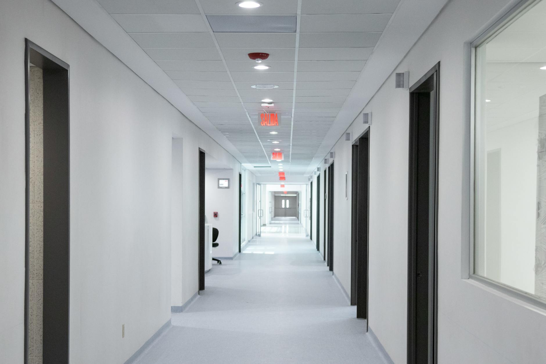 Clean, well-lit hospital hallway with medical equipment and professional healthcare environment