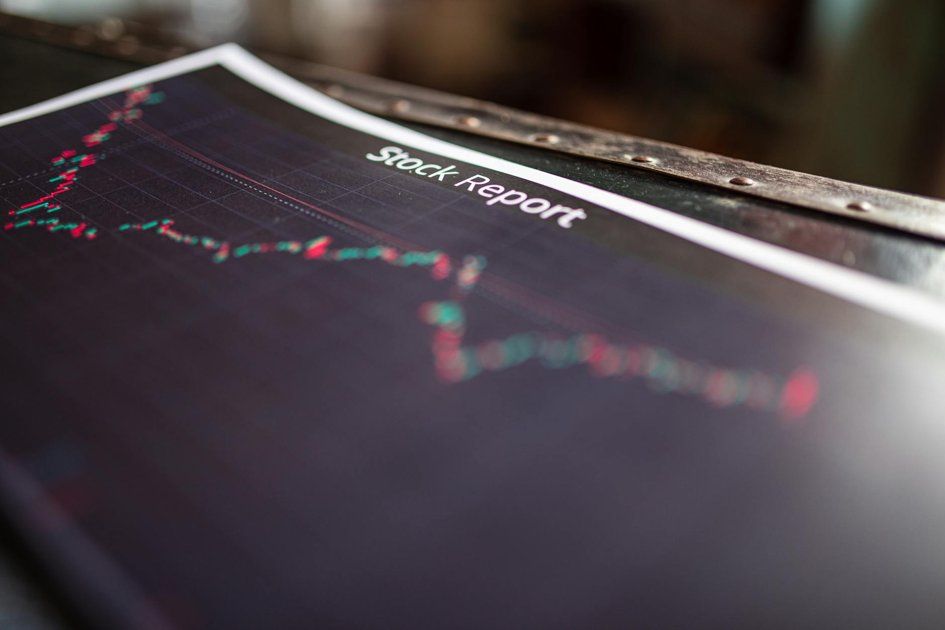 Financial charts and graphs displaying market data on computer screens