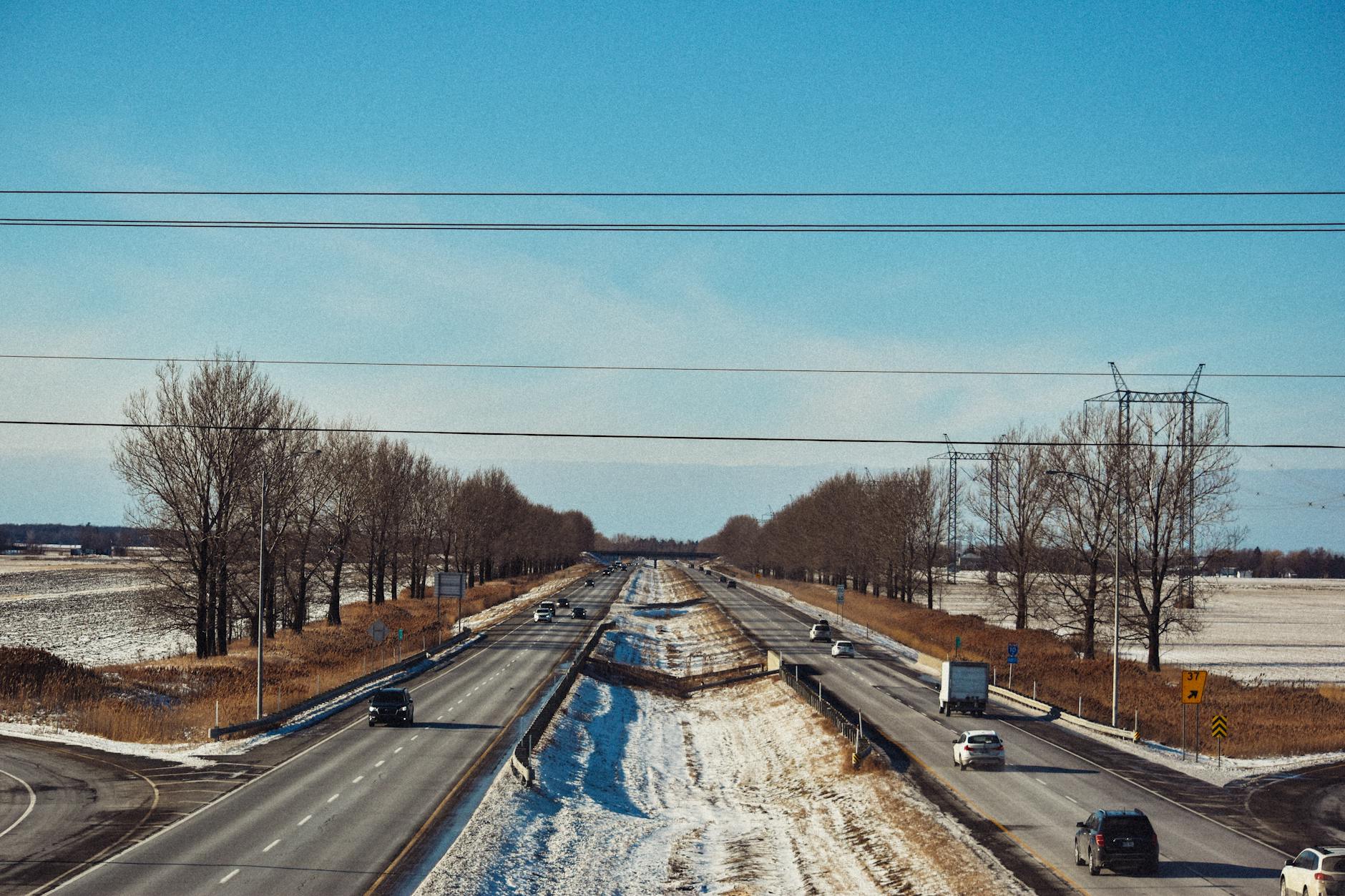 Busy highway with traffic showing infrastructure assets that generate toll revenue