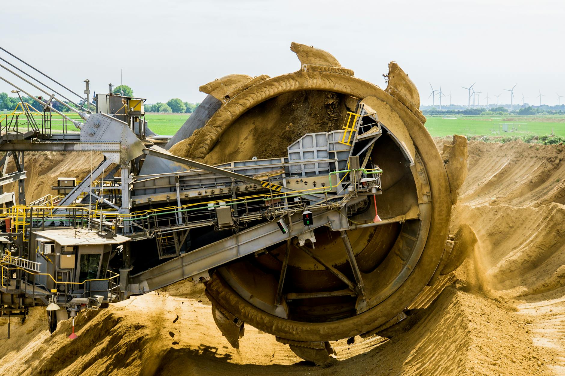 Heavy mining machinery at an open-pit gold mine operation site