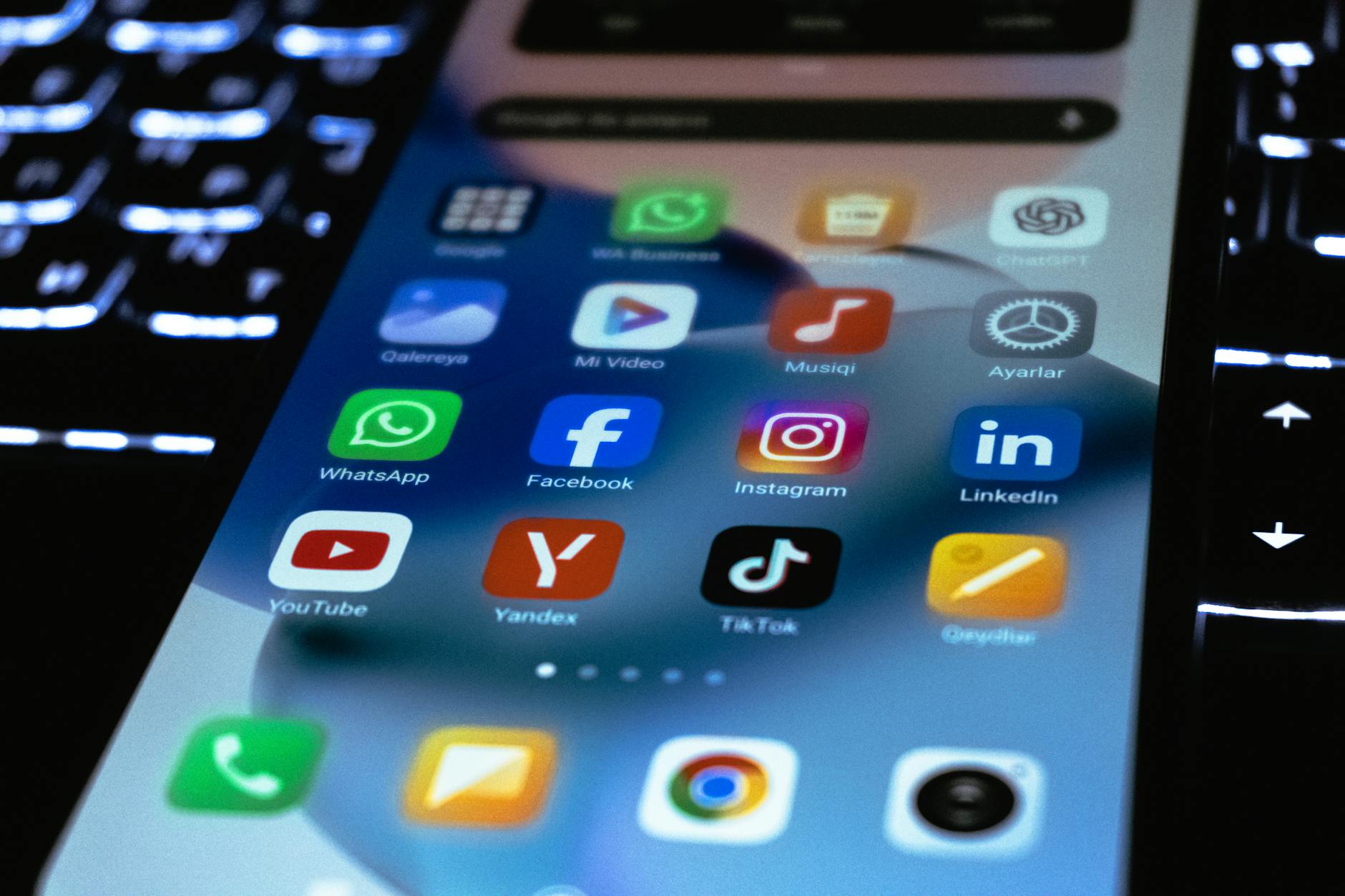 Multiple social media app icons displayed on mobile phone screen showing various platforms