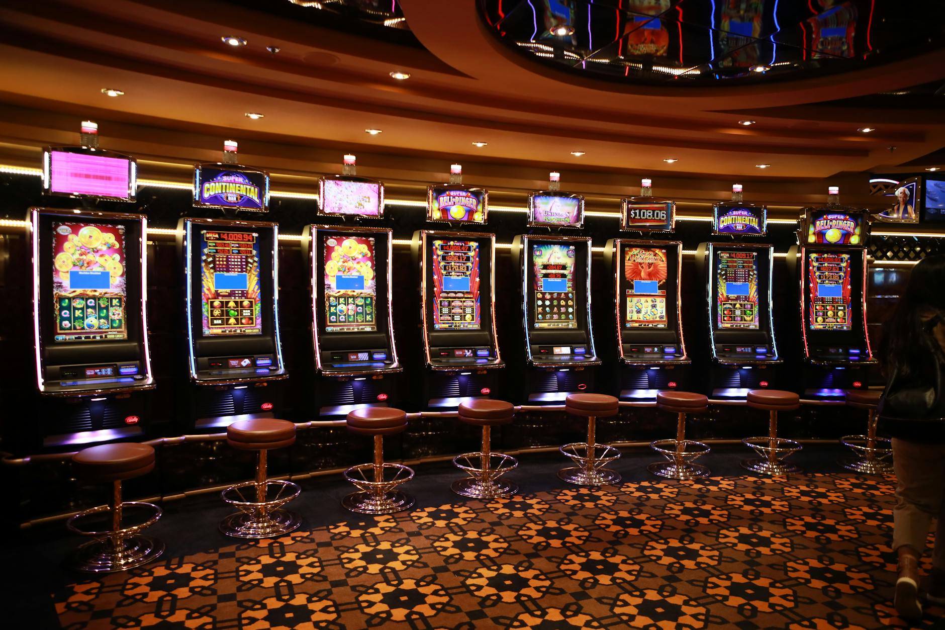 Traditional casino interior with slot machines and gaming tables