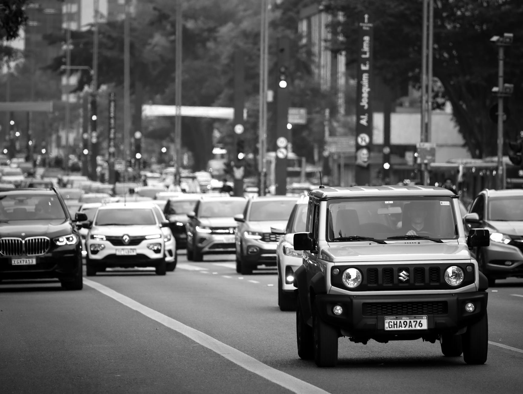 Urban street scene with cars and traffic representing transportation and delivery services