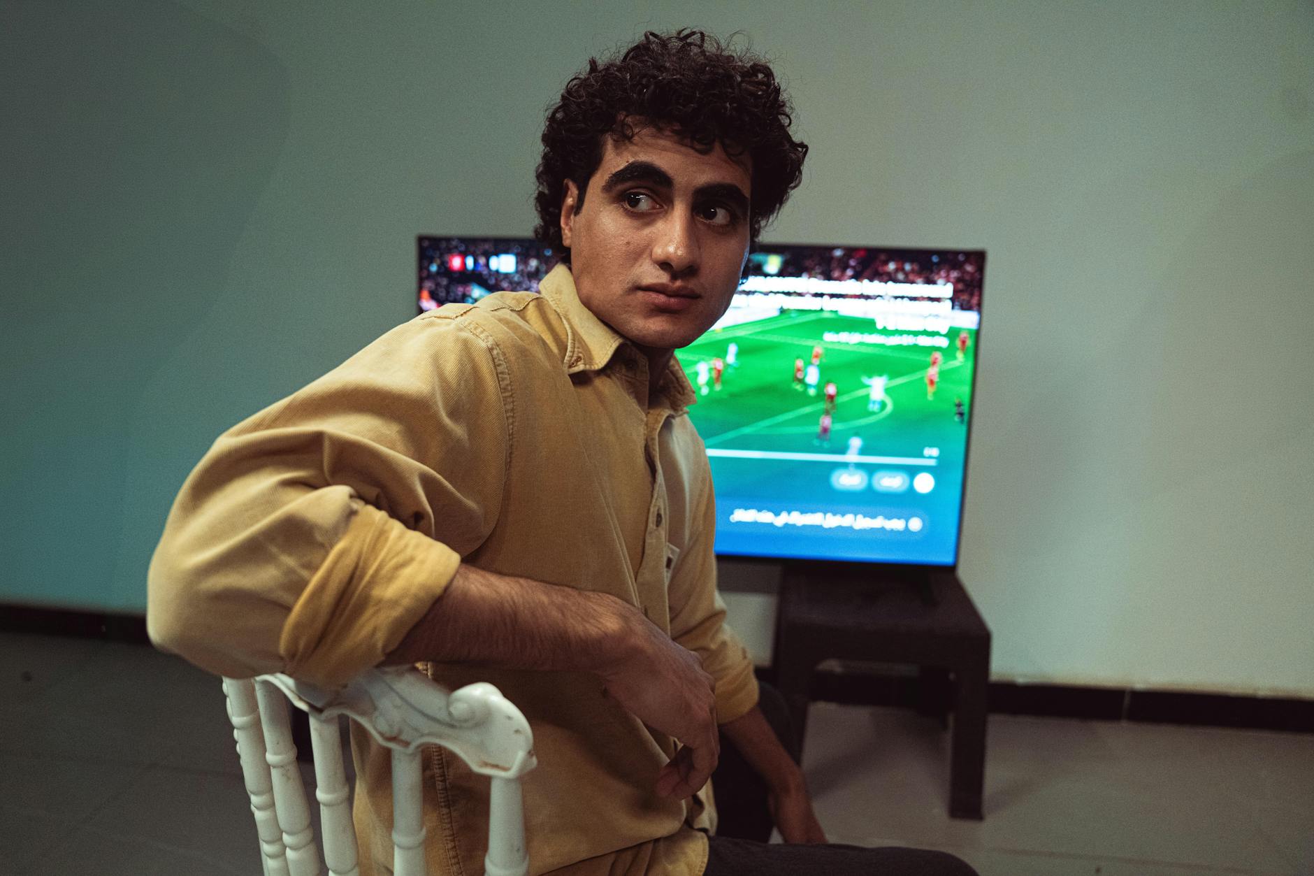 Television screen displaying live sports broadcast with multiple camera angles