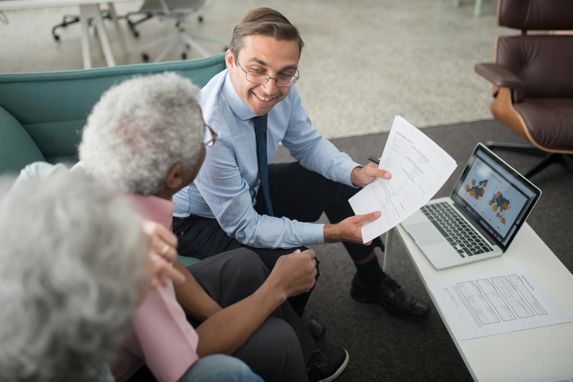 Investment documents and financial planning materials spread on desk