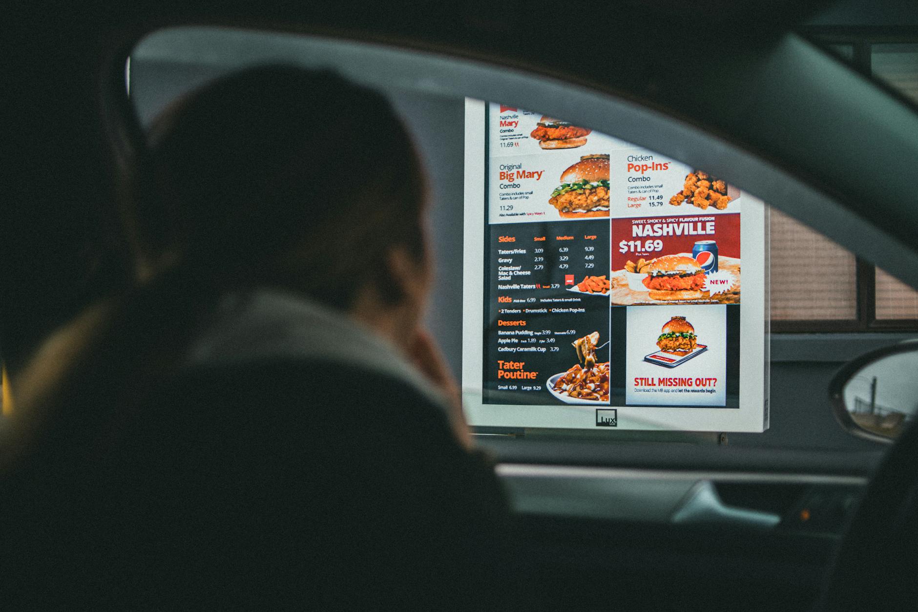 Modern fast food restaurant exterior with parking area and pickup zones
