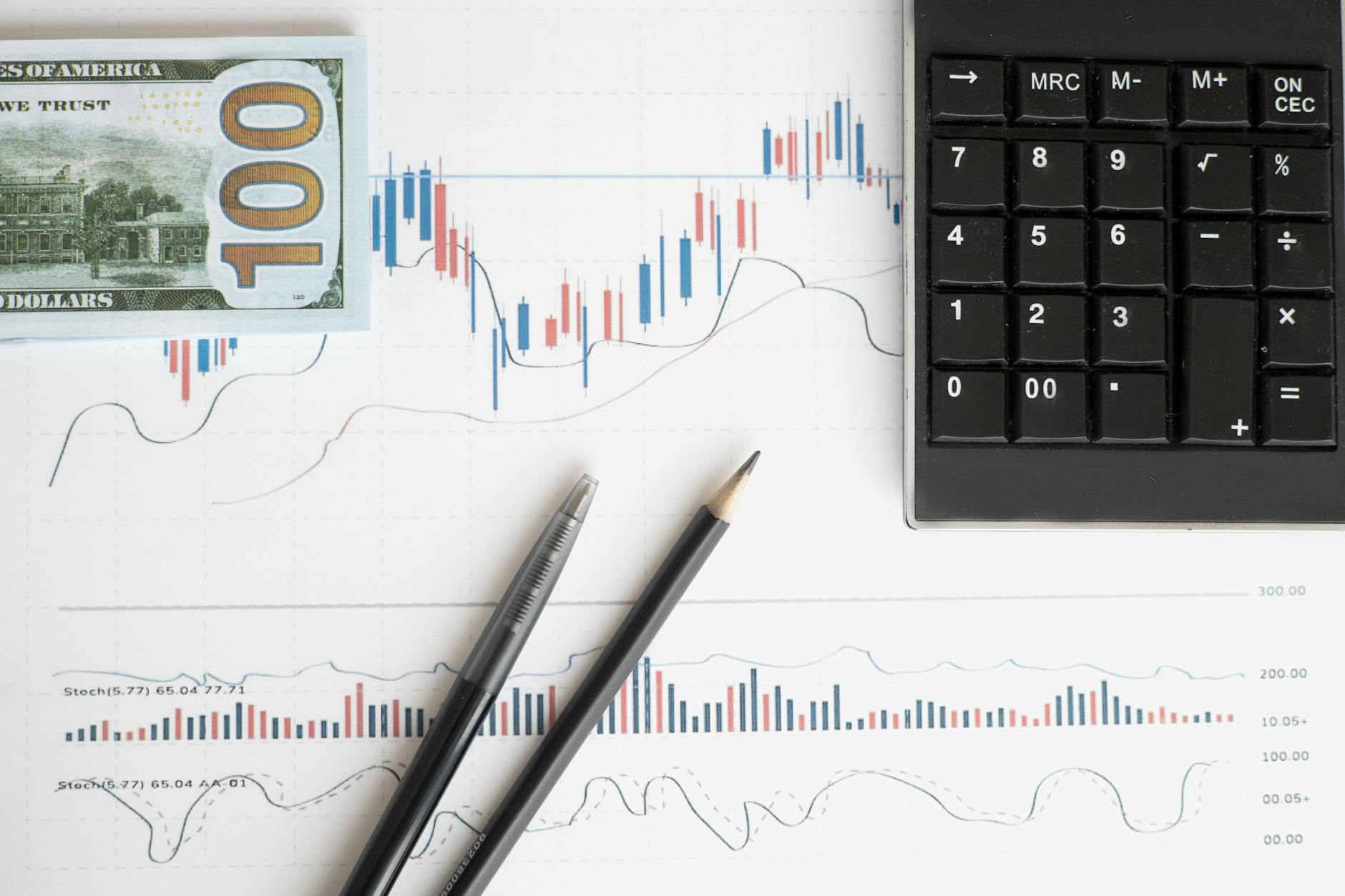 Financial analyst reviewing charts and investment data