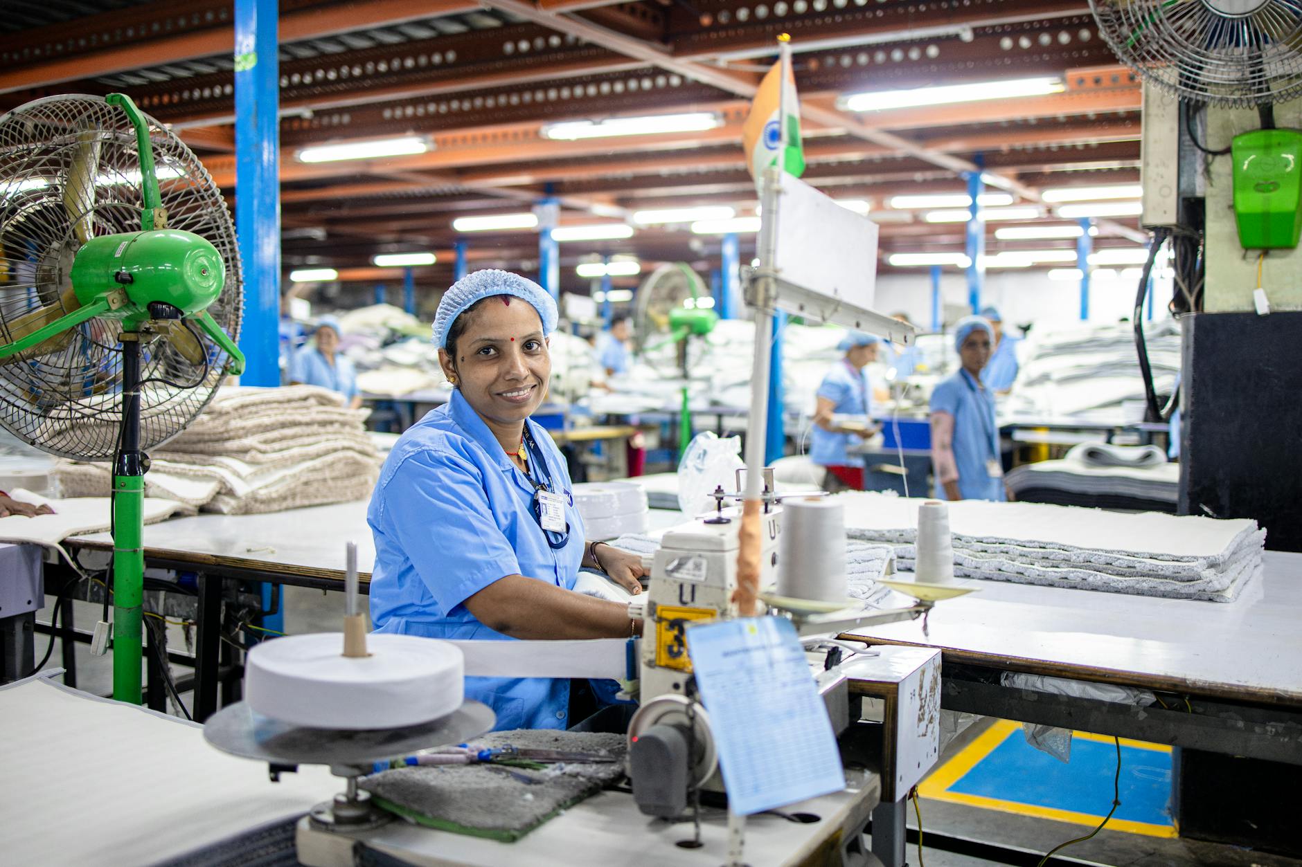 Workers on a manufacturing production floor assembling components