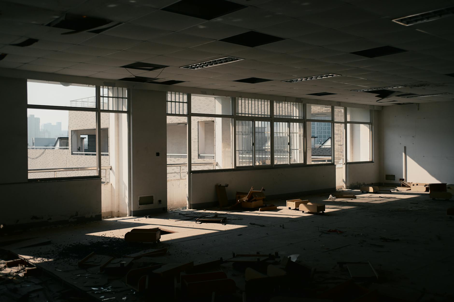 Empty newsroom with vacant desks and computer workstations