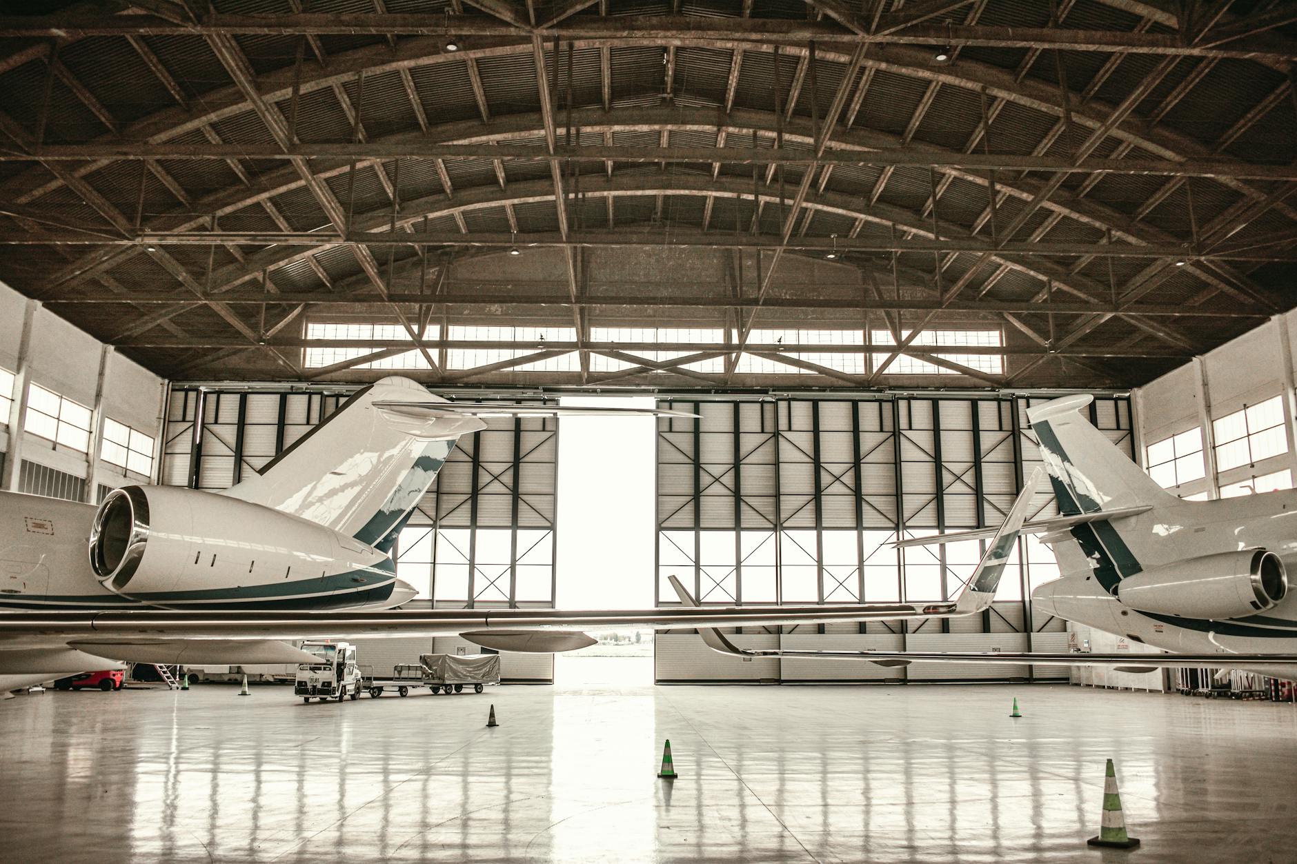 Commercial aircraft undergoing maintenance and modification work in airline hangar facility