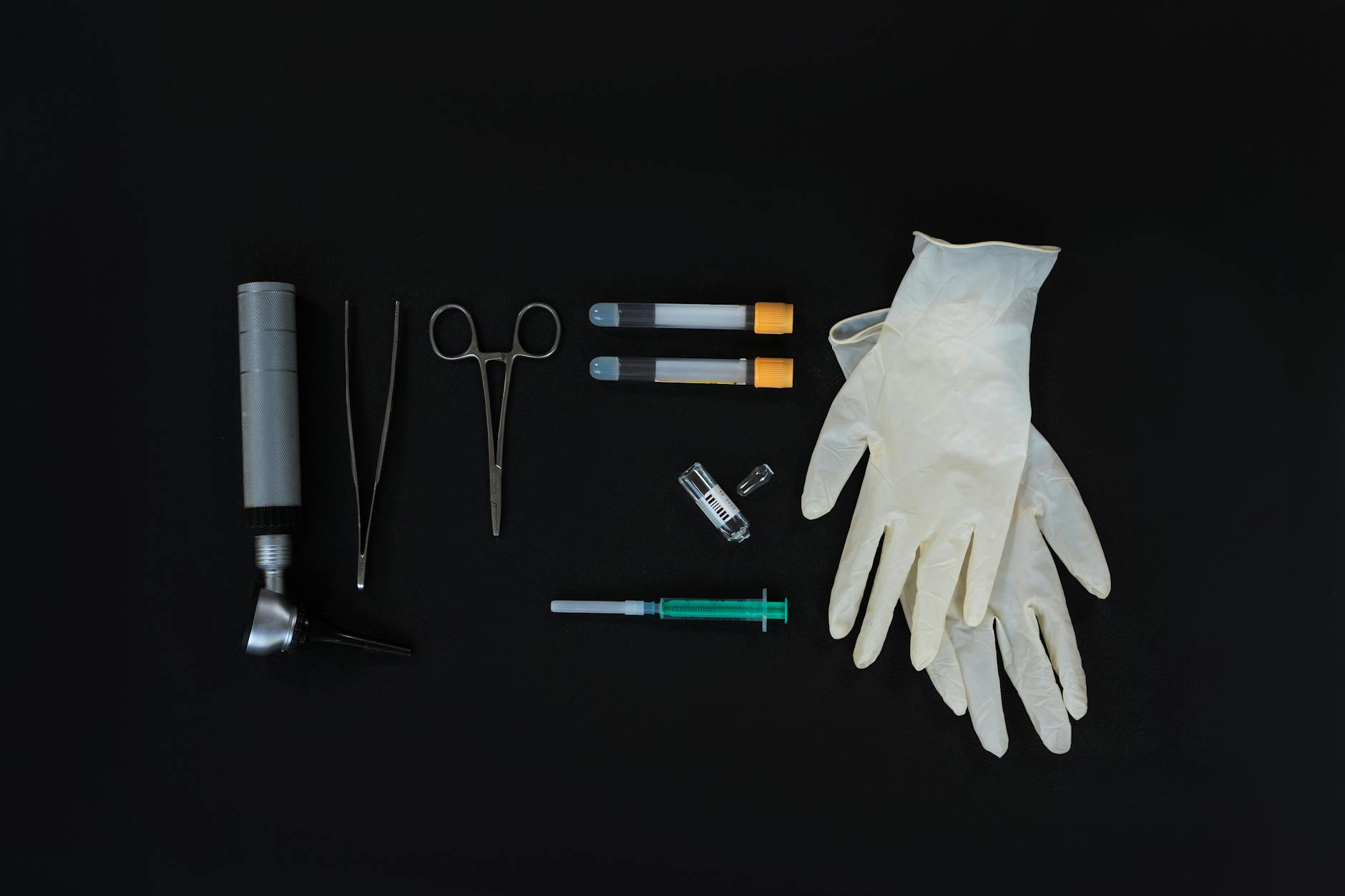 Blood pressure monitor and basic medical screening equipment on clean white surface
