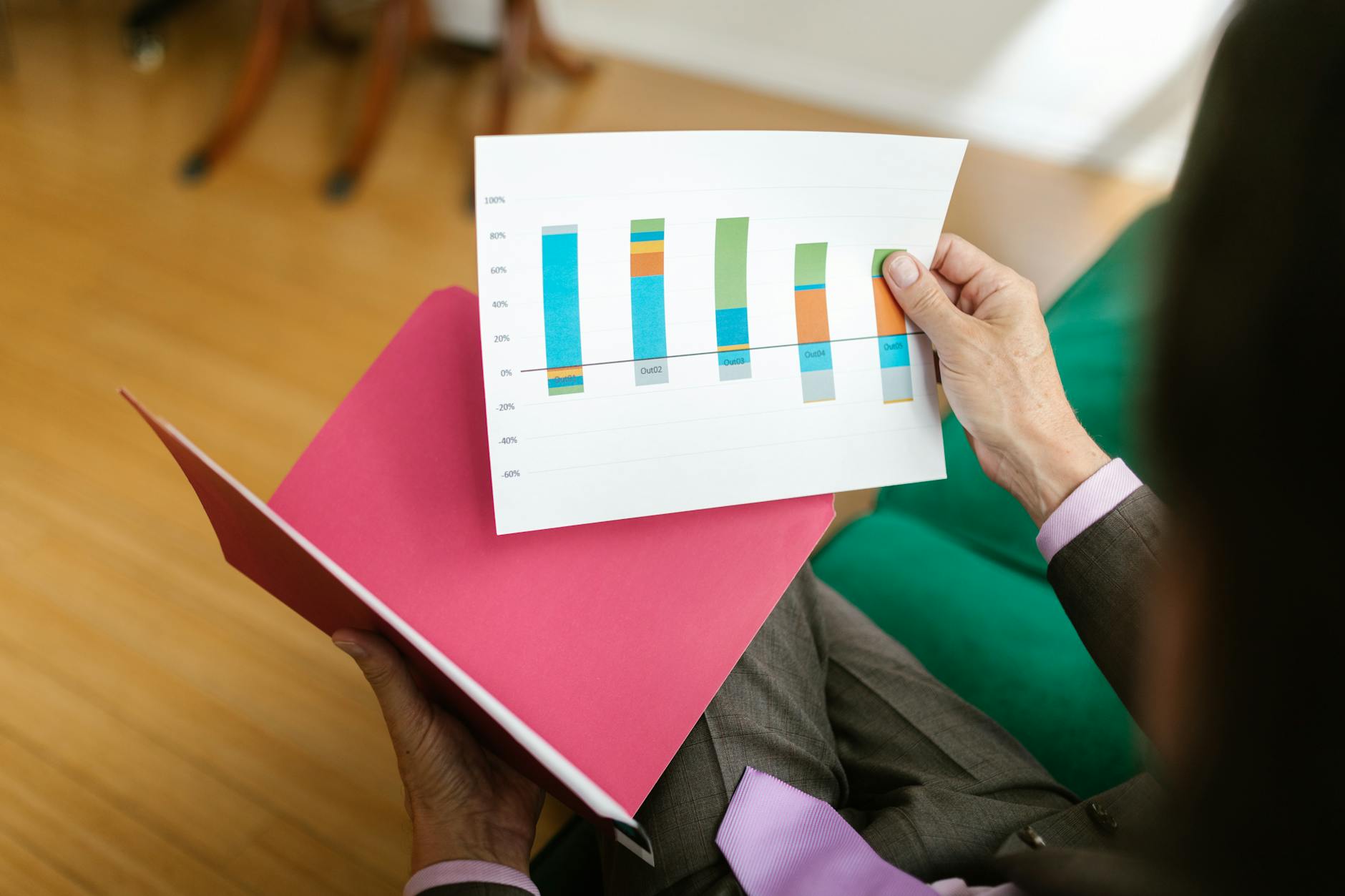 Investor reviewing municipal bond portfolio documents and tax-exempt income statements
