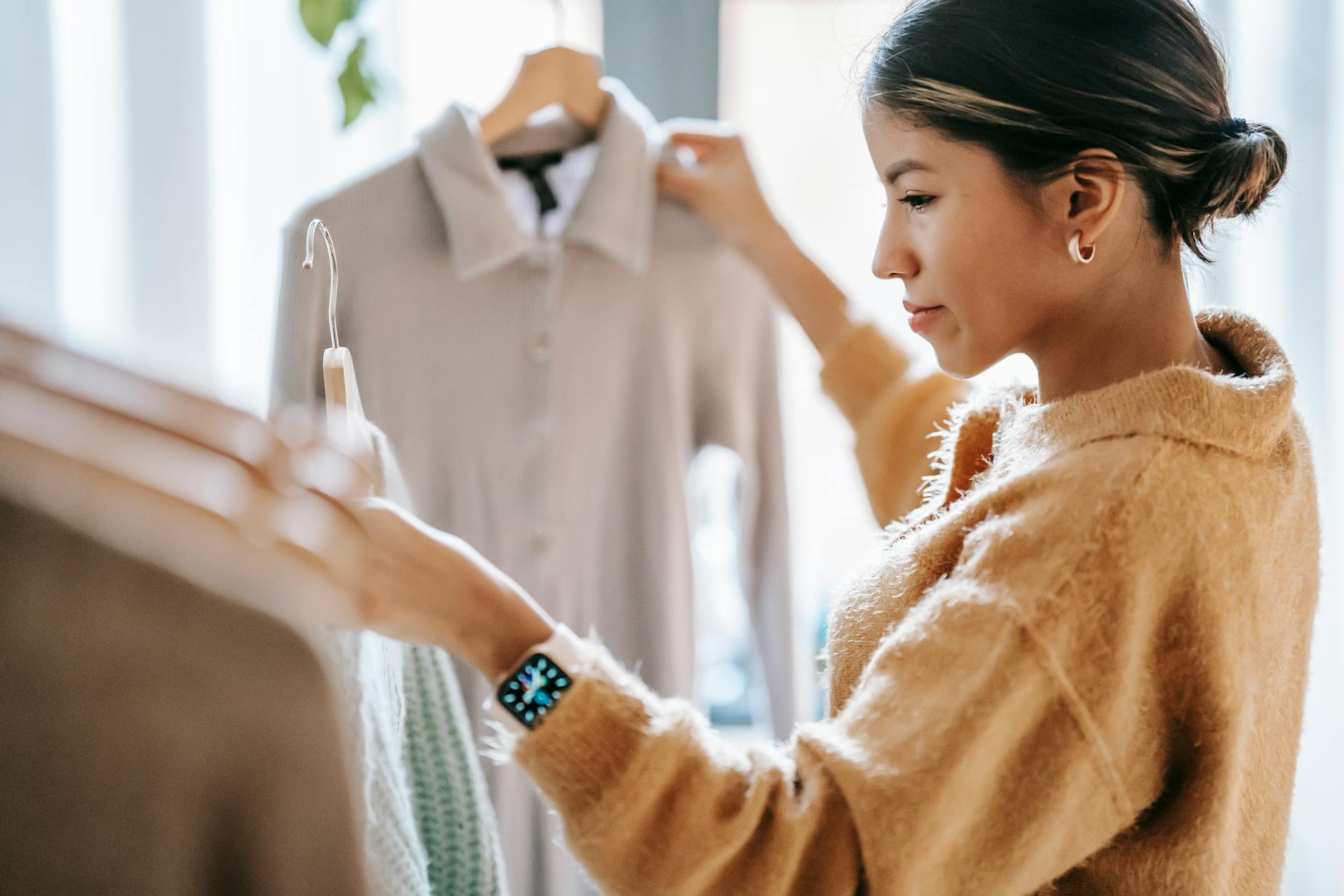 Woman browsing products in an upscale fashion store