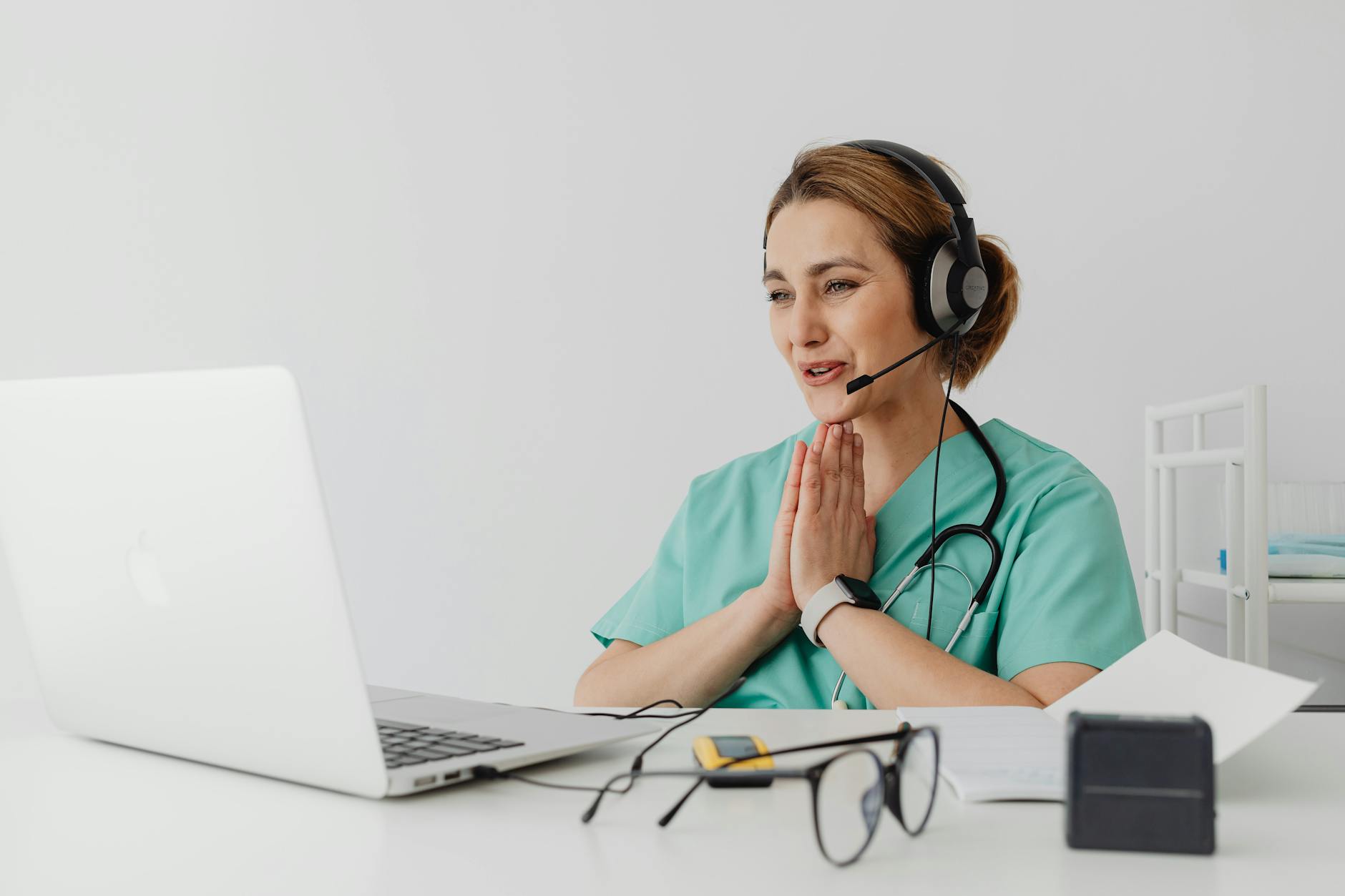 Healthcare professional consulting with patient in clinical setting