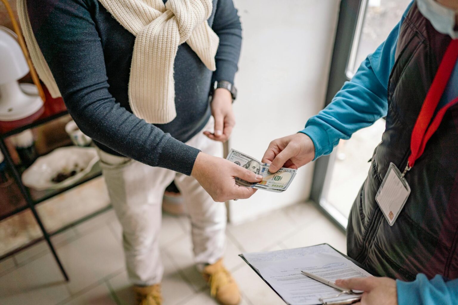 Person using a mobile phone to send a money transfer internationally