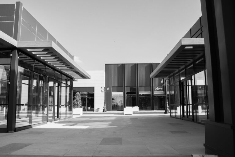 Empty storefront in a rural strip mall representing dollar store closures in small towns