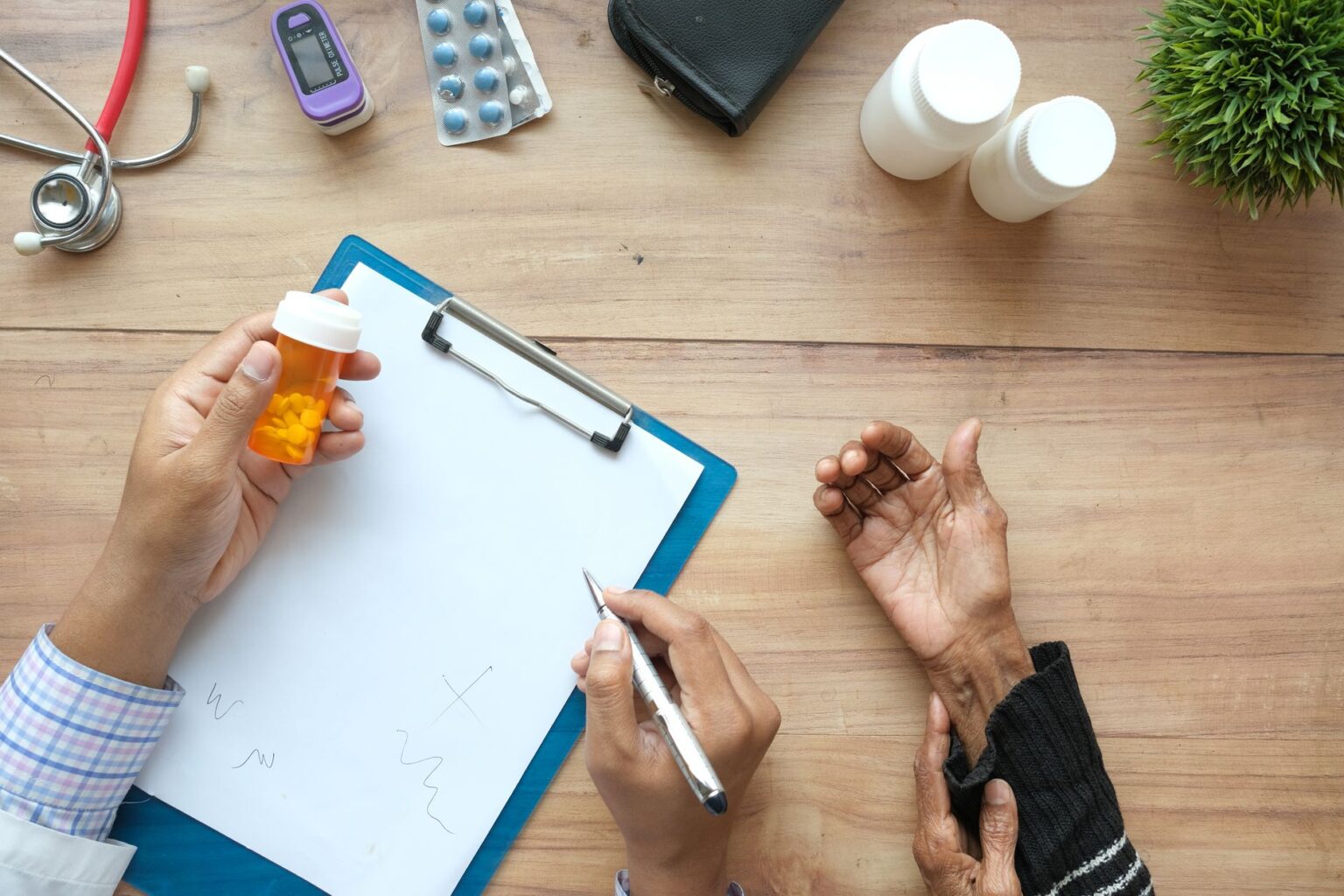 Pharmacist reviewing prescription bottles at a pharmacy counter