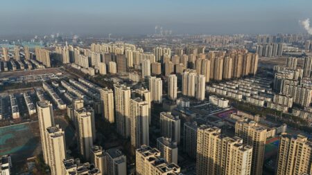Rent Growth Slows in Sun Belt Cities as Apartment Supply Surges Aerial view of a large apartment complex in a Sun Belt city