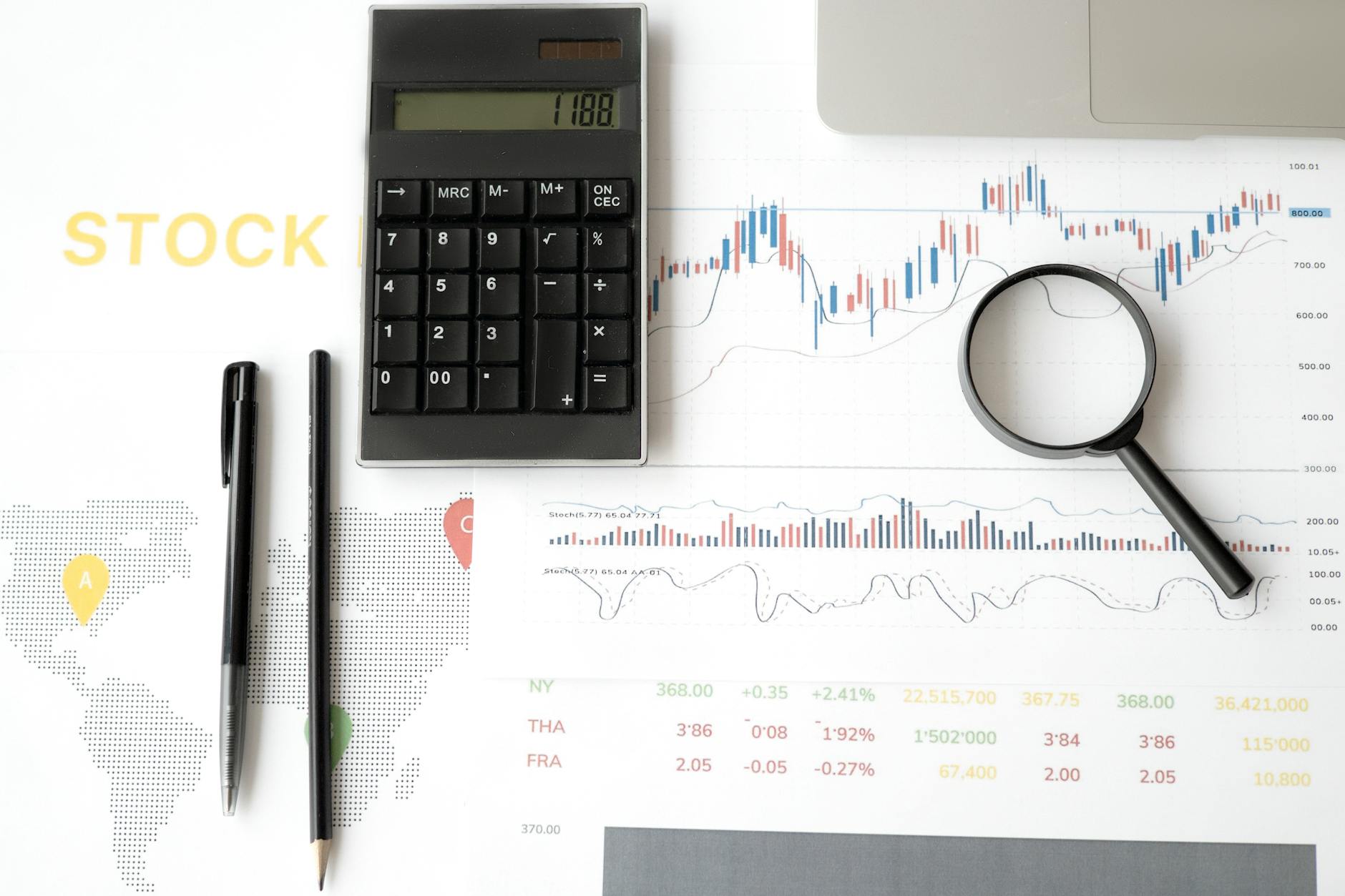 Financial analyst reviewing yield curve and bond market data on computer screens
