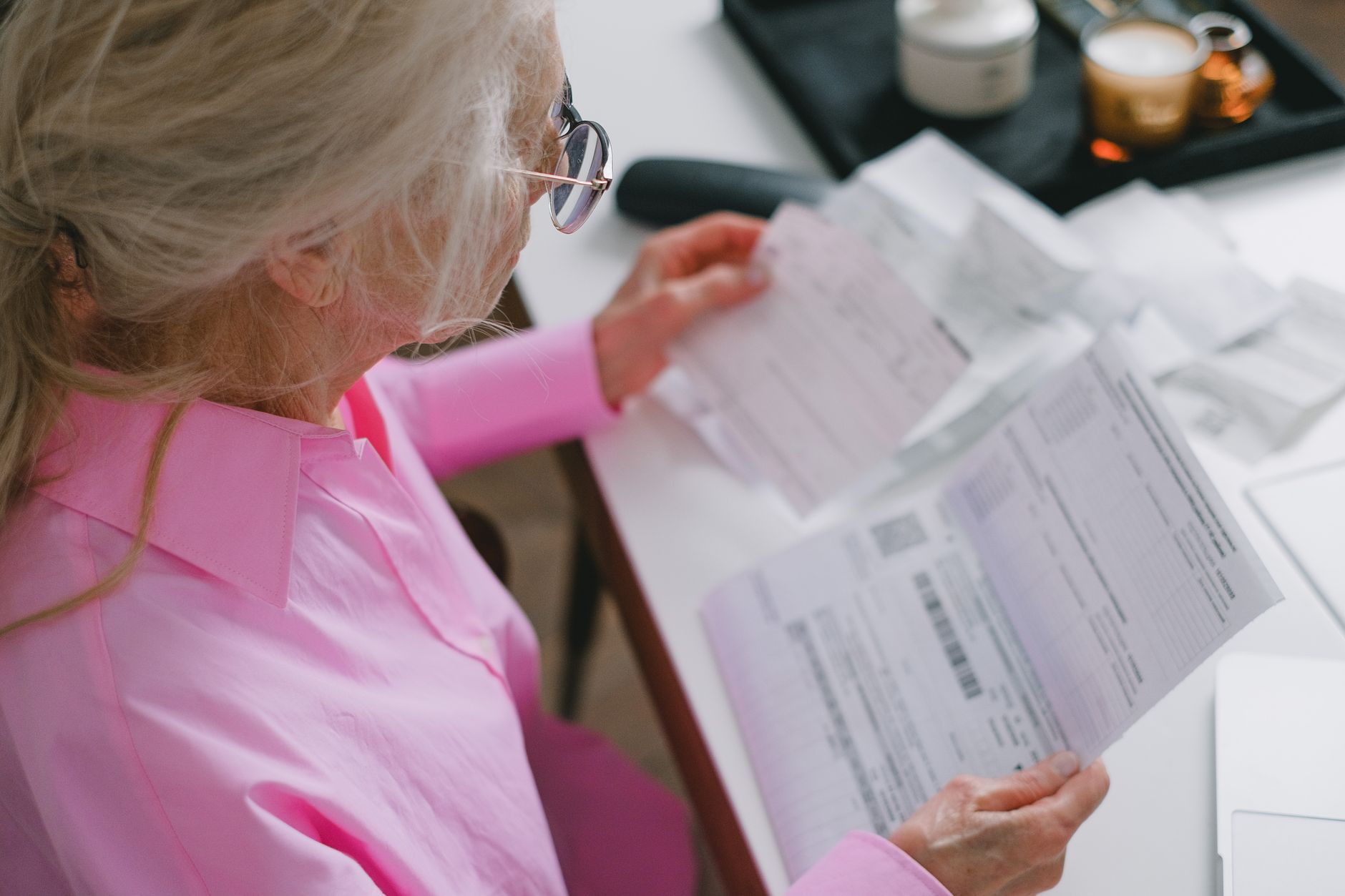 Medical billing administrator working at a hospital administrative desk
