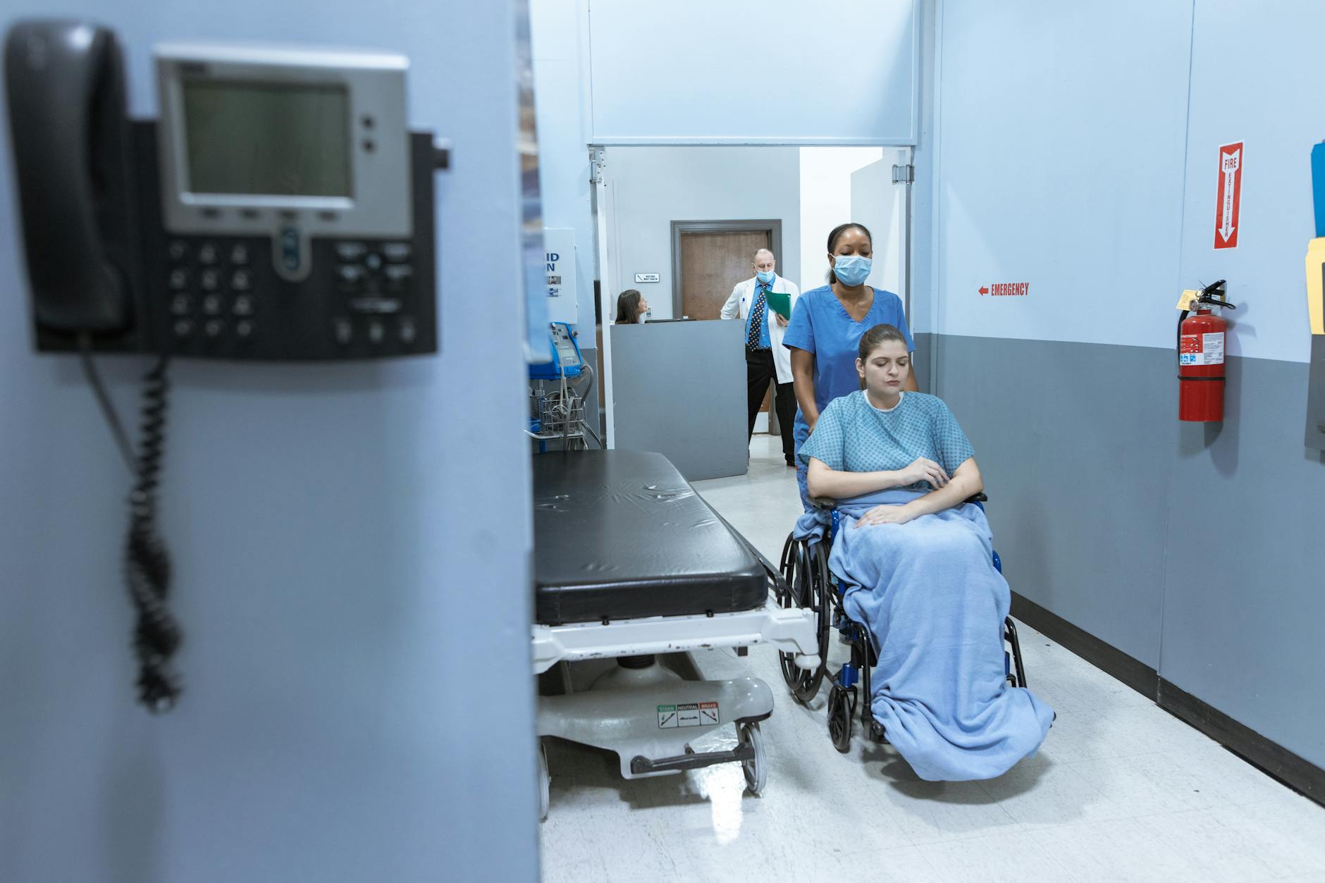 Small rural hospital exterior showing the healthcare infrastructure at risk from Medicaid enrollment drops