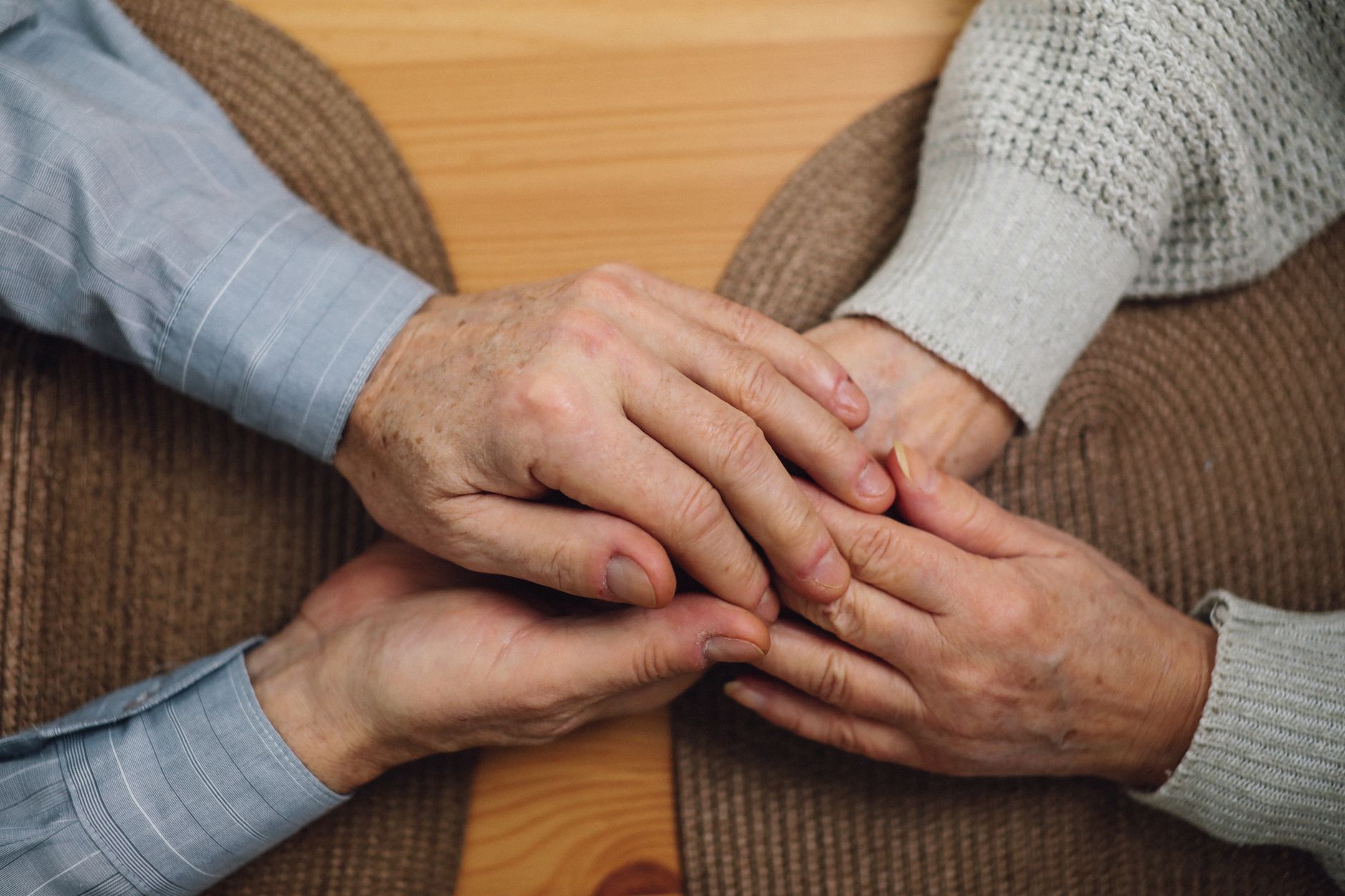 Elderly resident receiving assistance from a caregiver in a long-term care setting