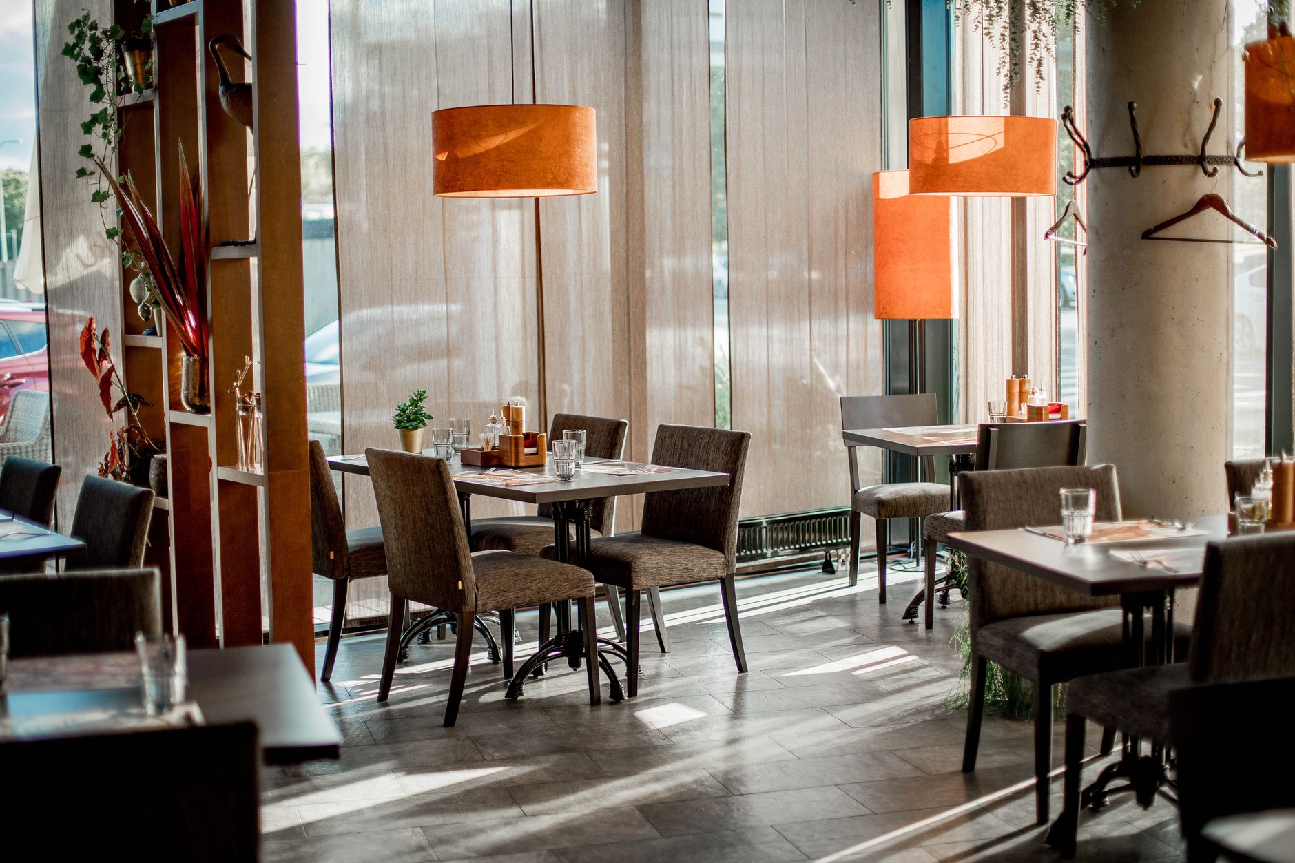 Quiet restaurant interior with empty tables during what would normally be a busy lunch hour