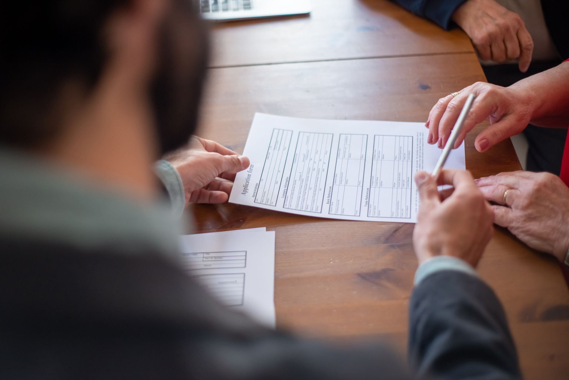 Person reviewing insurance documents at a desk