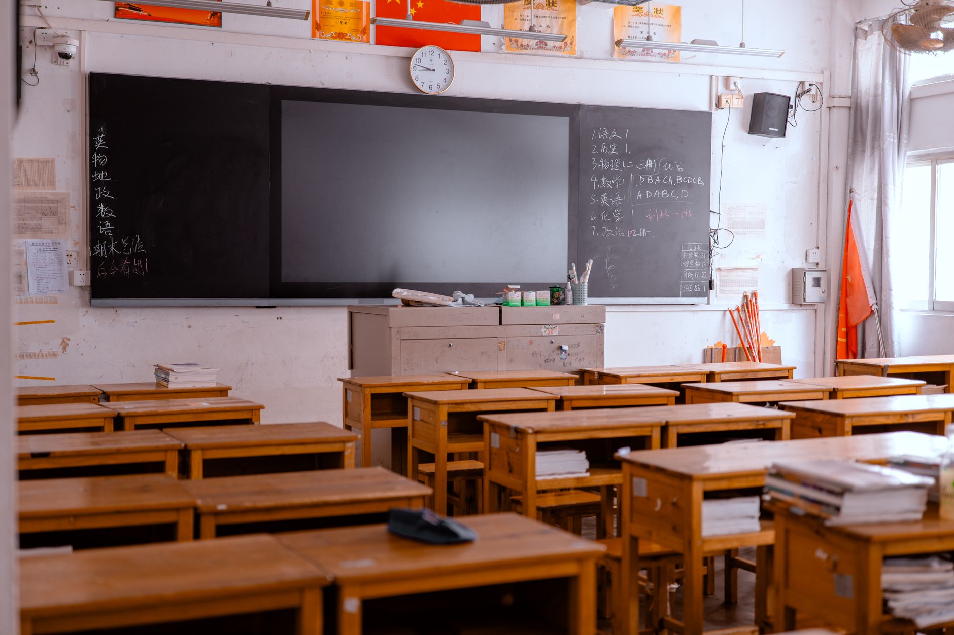 Empty child care classroom with small chairs and tables, no children present