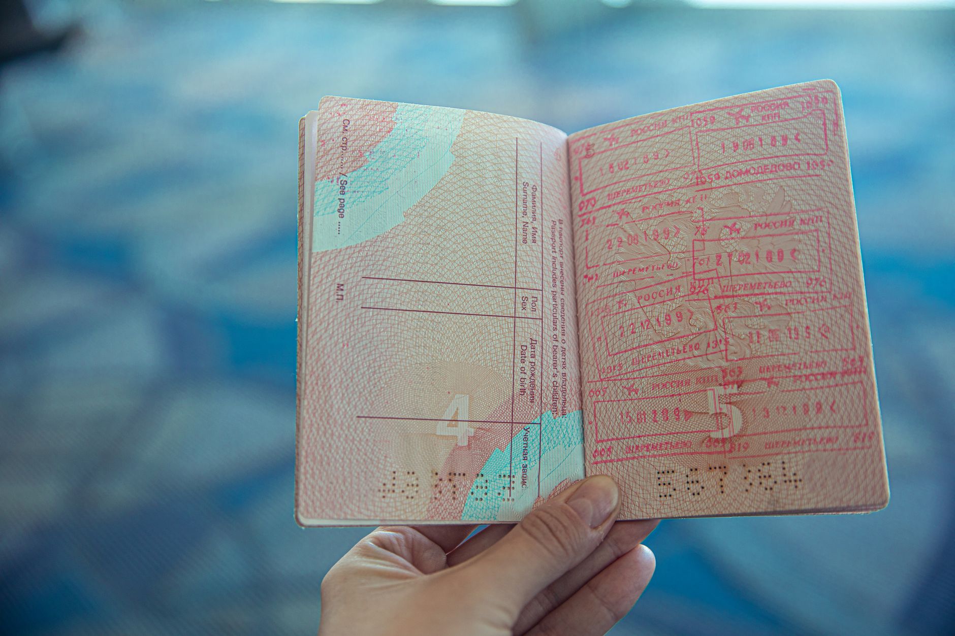 Visa application documents and forms spread on a desk