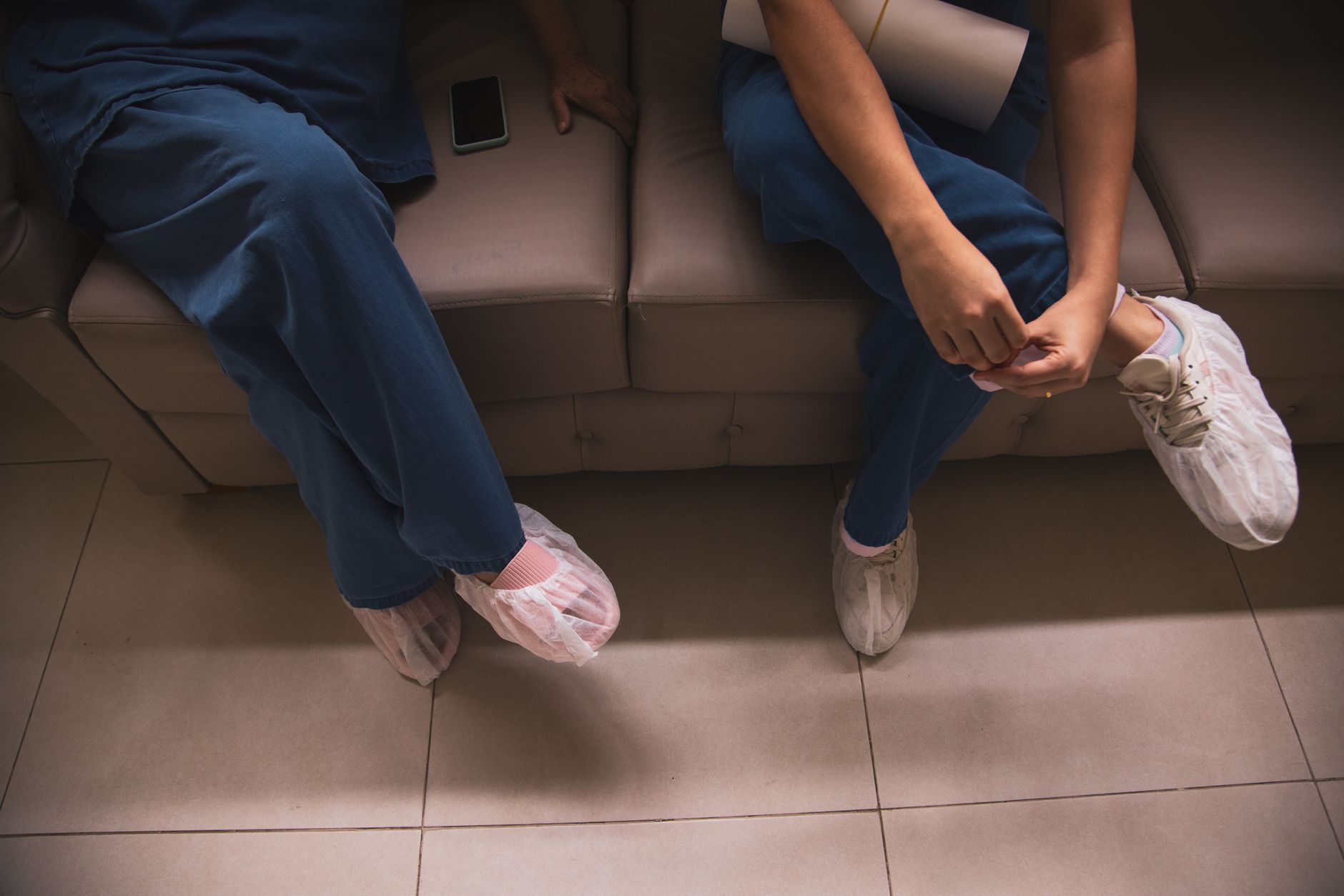 Patients seated in a hospital waiting room