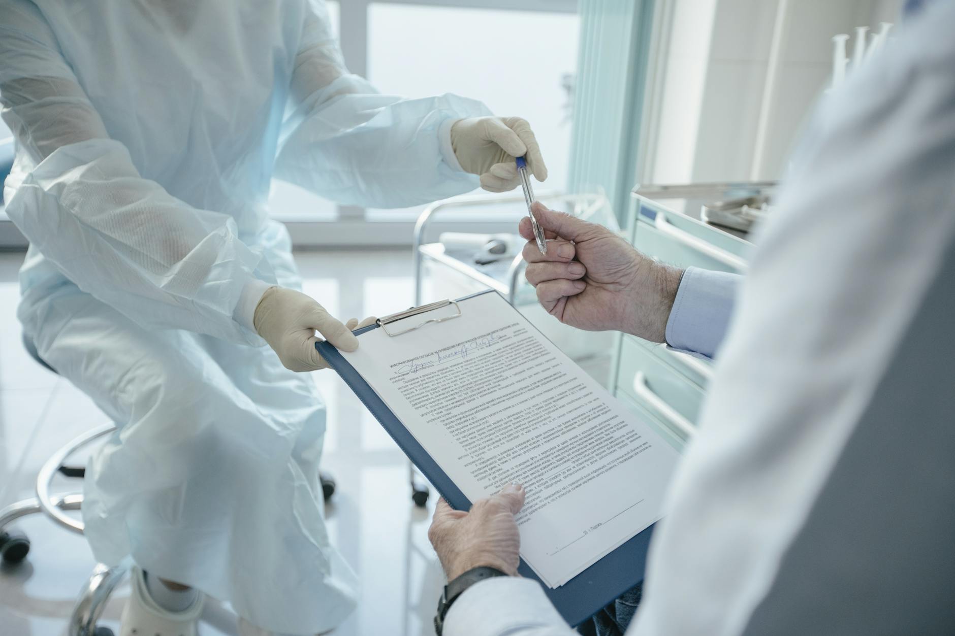 Person reviewing health insurance and medical paperwork at a desk