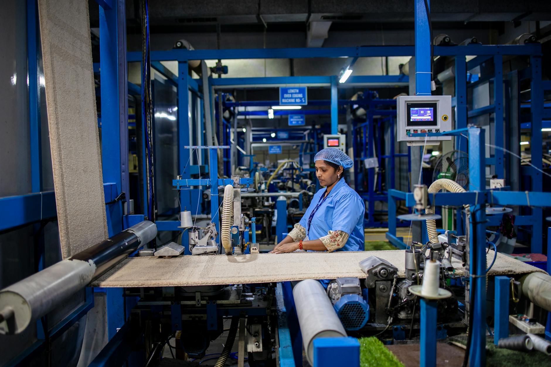 A technician working at a precision manufacturing workstation