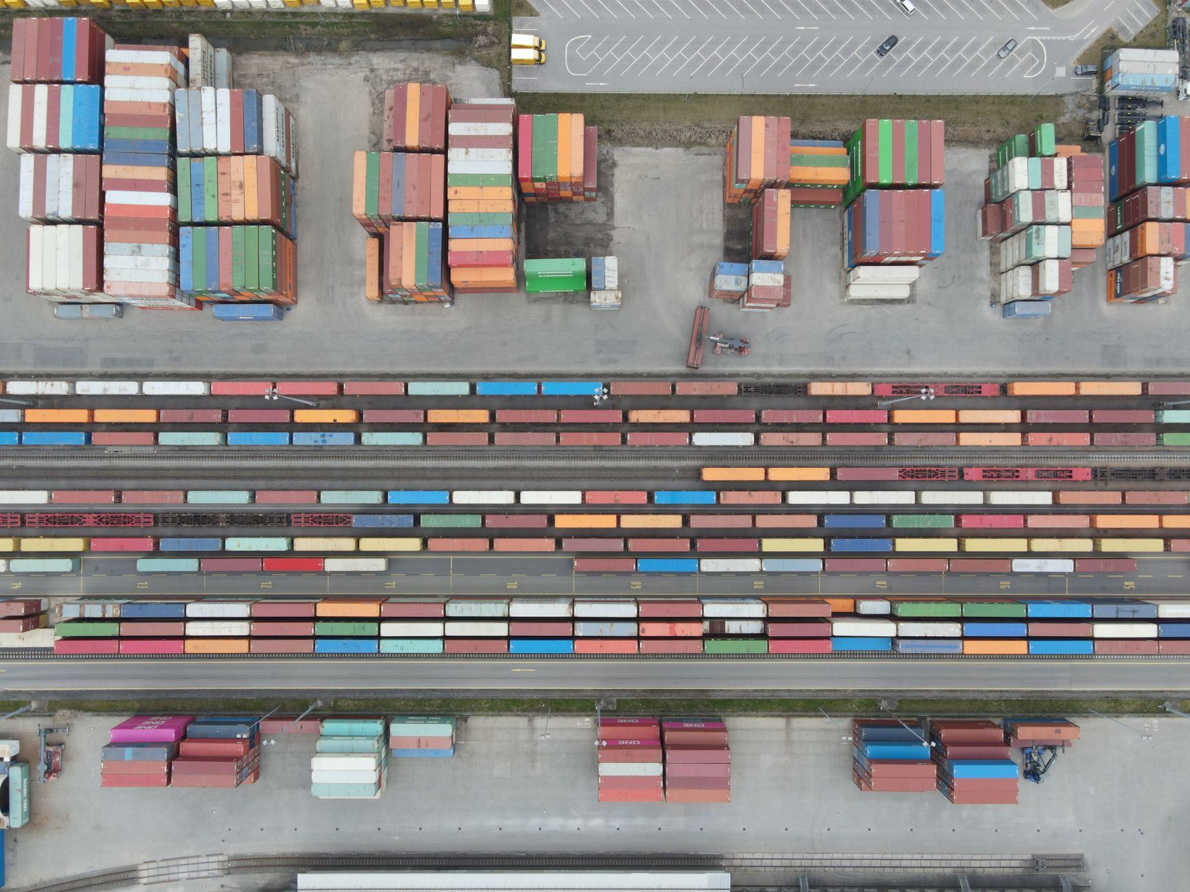 Logistics office workers reviewing freight and trucking rate data