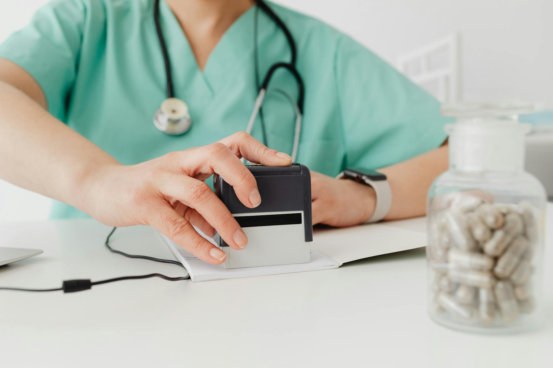 Healthcare administrative paperwork representing the compliance burden of Medicaid work requirement programs