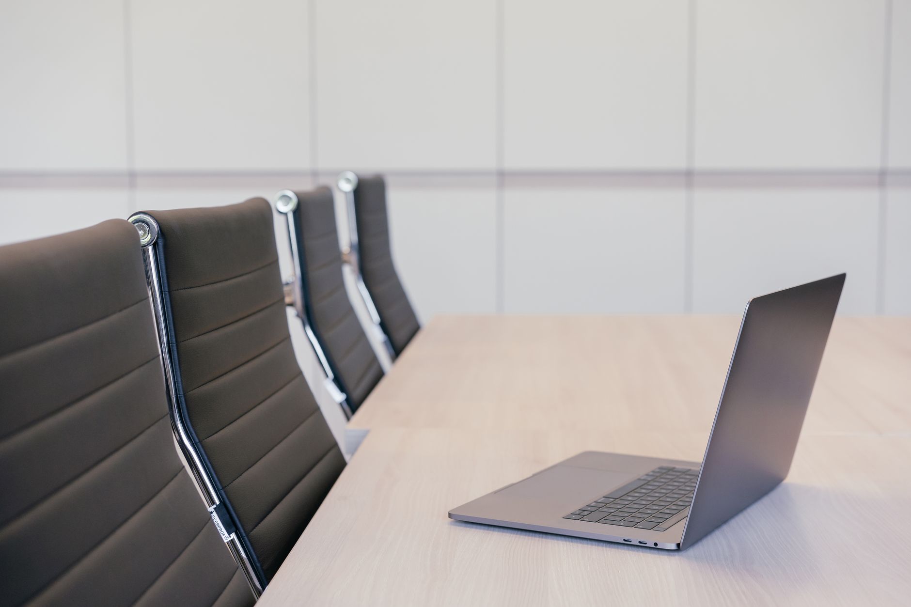 Business professionals reviewing financial documents at a conference table